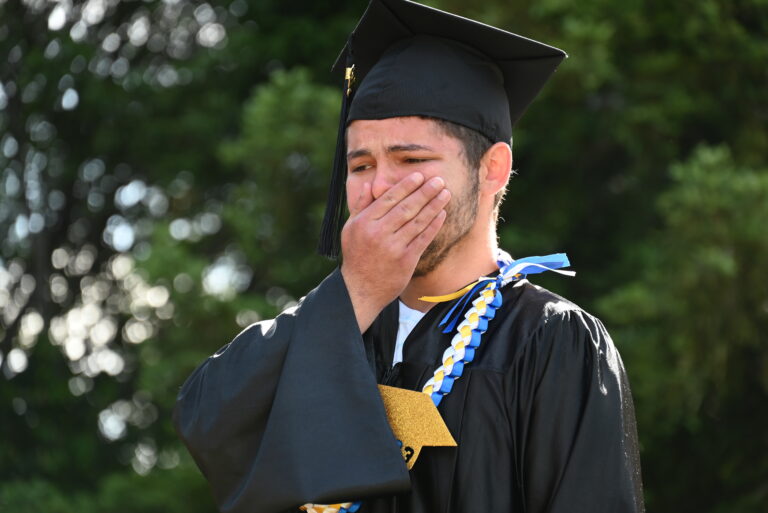 Boy having an emotional moment while graduating