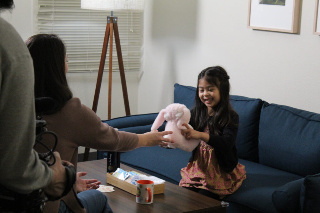 Child with stuffed animal